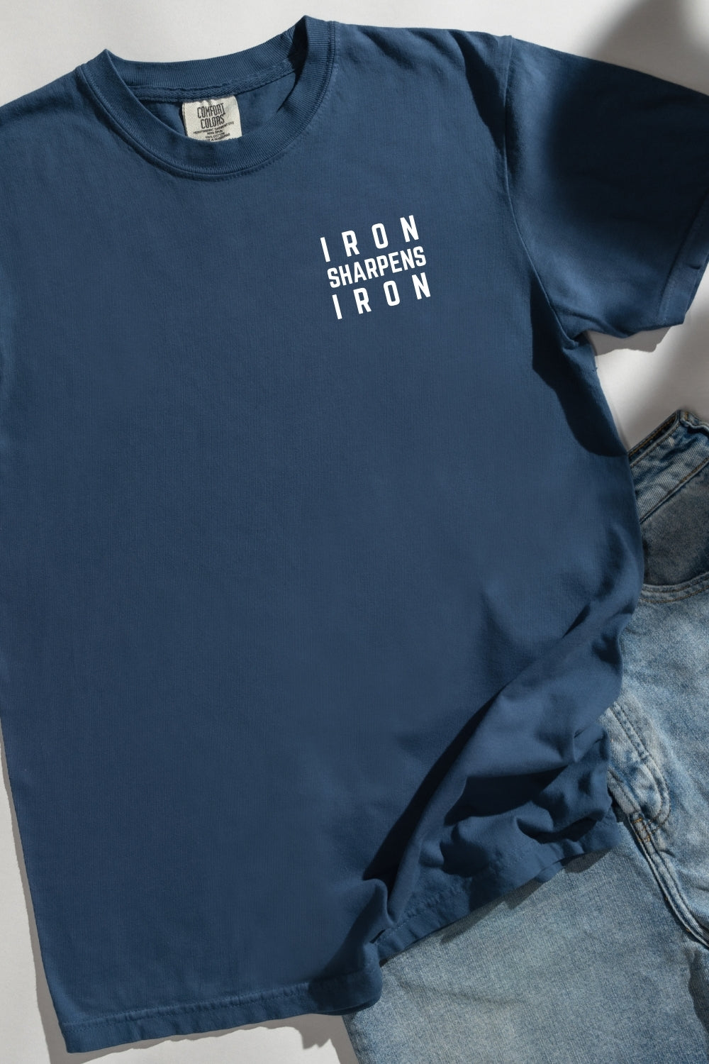 Iron Sharpens Iron Comfort Colors Midnight T-Shirt Flatlay